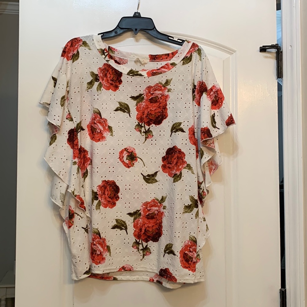 Spring floral tunic, eyelet style fabric with bold rose print.